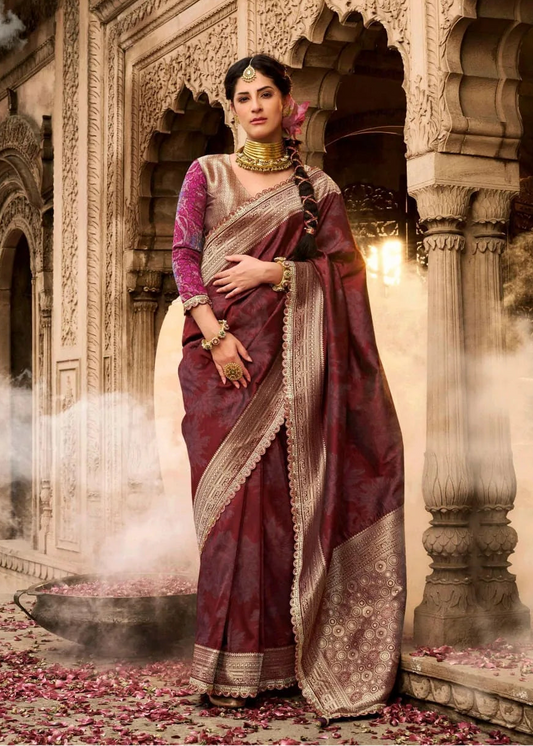 Woman in traditional saree standing in an ornate architectural setting with Kira logo.